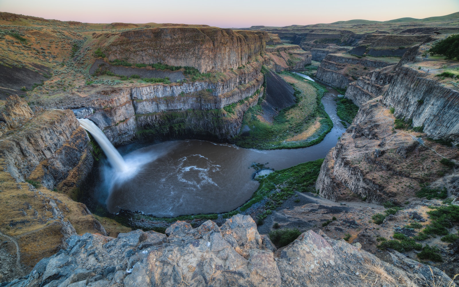 bird eye view photography of waterfalls between cliffs