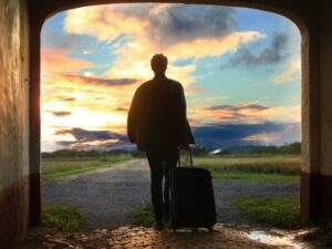 man holding luggage photo